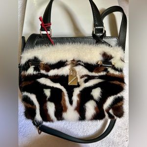 Valentino Garavani
Black & White Mink Fur and Leather Handbag
Brand New
COA